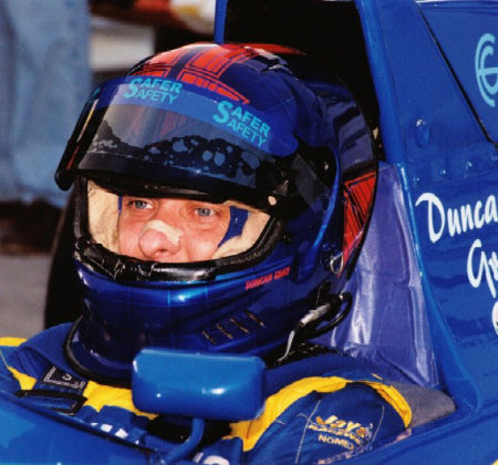 Close up of Duncan Gray in his Formula 3000 car